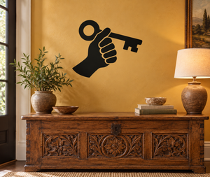 Black vinyl decal of a hand holding a key