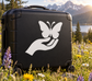 Vinyl decal of a hand holding a butterfly on a suitcase