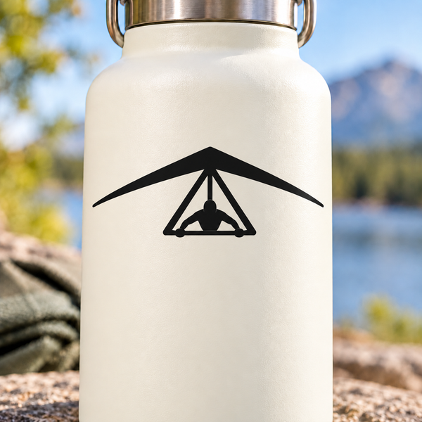 Black hang-gliding control triangle vinyl decal on white surface with control icon
