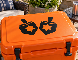 Orange cooler vinyl decal with two black dreidel shapes and orange star icons