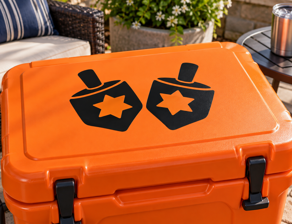 Orange cooler vinyl decal with two black dreidel shapes and orange star icons