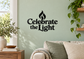 Vinyl wall decal reading “Celebrate the Light” with flame icon above