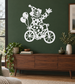 Clown on bicycle vinyl decal with polka-dot suit, white outlines, green spots.