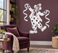 White vinyl clown decal of a dancing jester with bow and polka-dot outfit