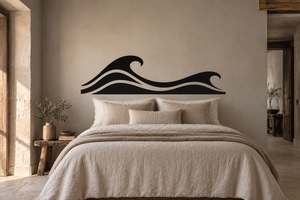 Ocean wave vinyl decal on wall above bed, black crest with flowing lines