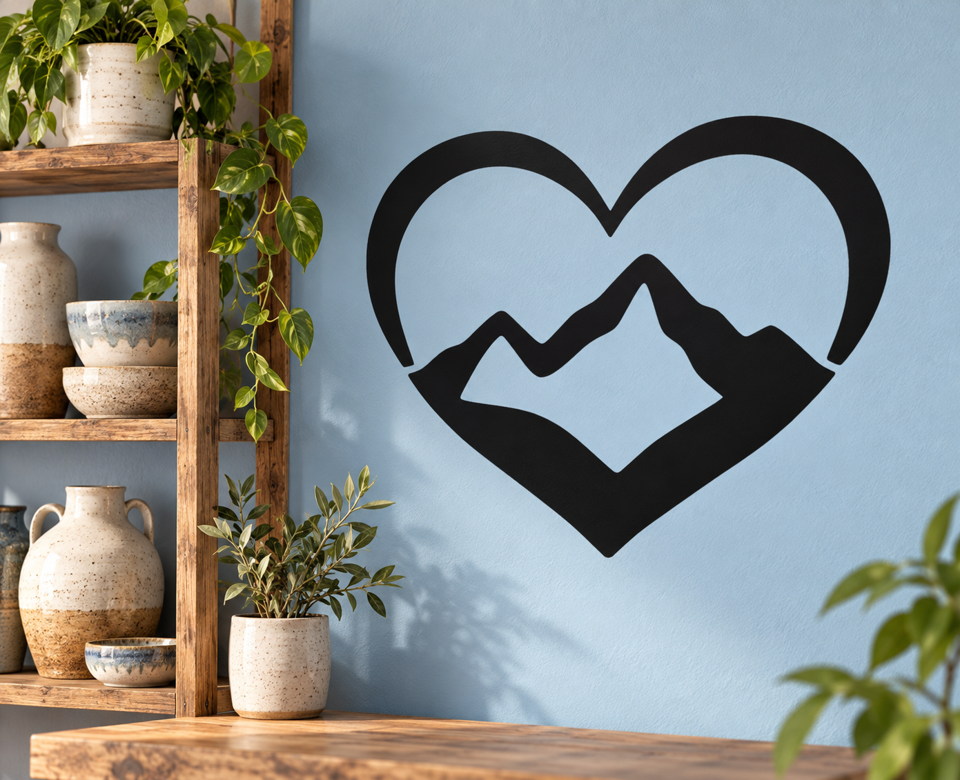 Black heart-shaped vinyl decal with mountain ridge design