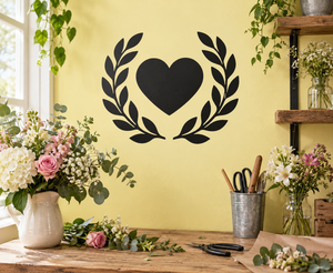 Black heart vinyl wall decal with open laurel wreath design