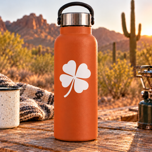 Four-heart clover vinyl decal with long curving stem, white design on dark surface