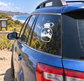 Vinyl decal of hiking bottle with mountain and sun icon on car window
