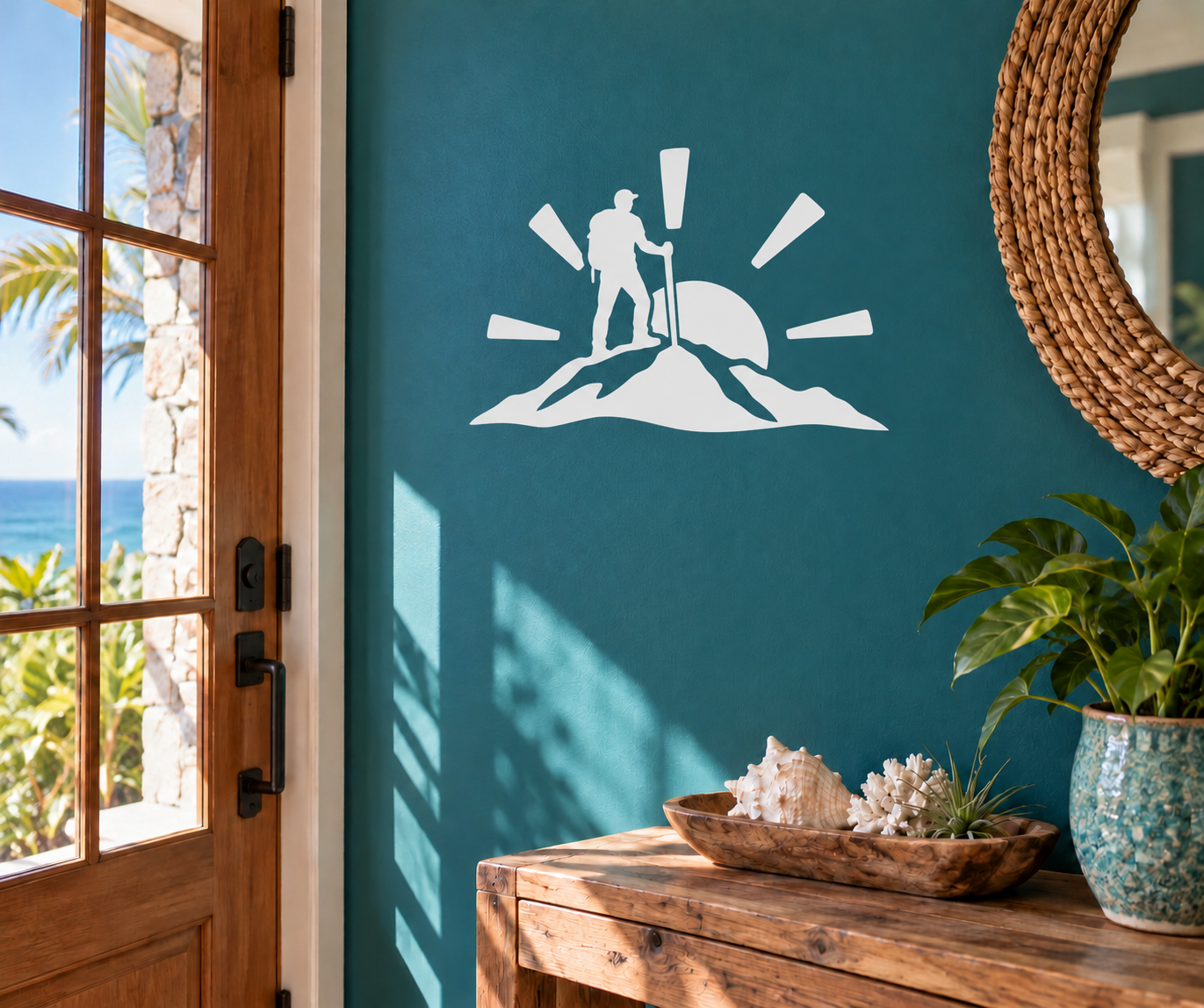 White hiking silhouette vinyl decal on teal wall, runner with trekking pole and mountain base