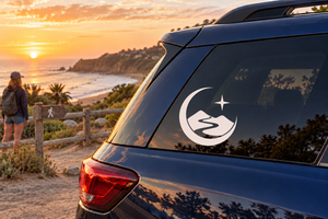 Car window vinyl decal with moon and mountain silhouette, star accent