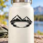 Black vinyl decal with mountain peaks and wavy lake emblem on light bottle