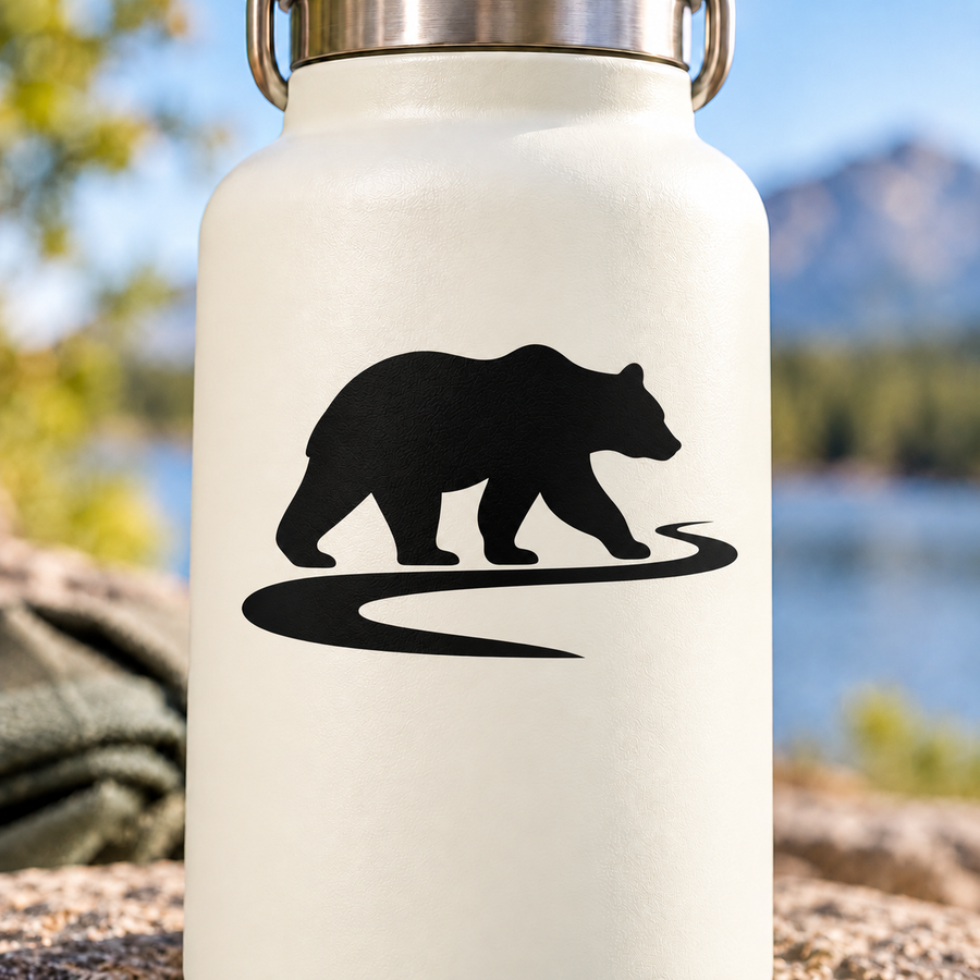 Black bear vinyl decal with paw-scratch trail line on light backing
