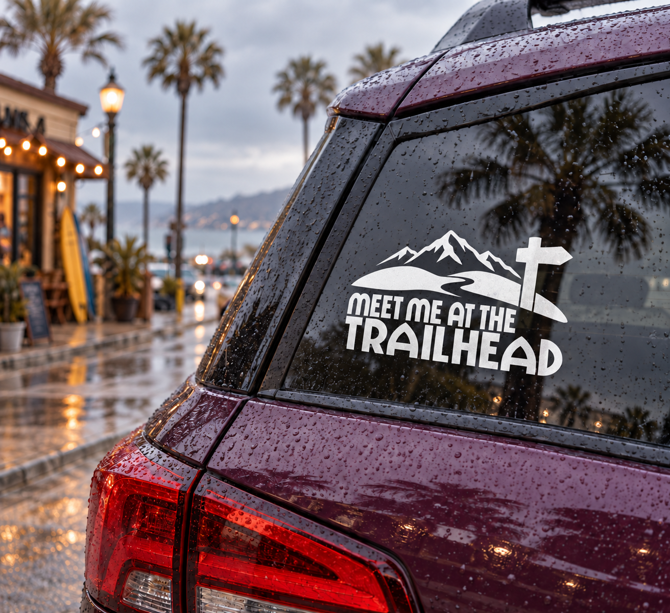 Vinyl decal with mountain silhouette, cross, and text "MEET ME AT THE TRAILHEAD"
