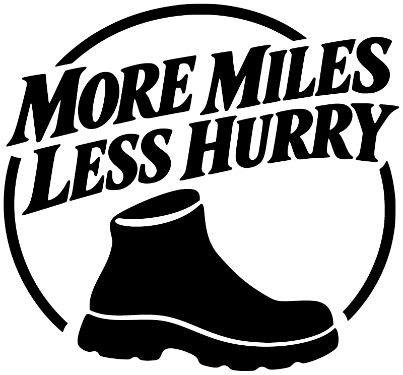 Vinyl hiking decal with bold 'MORE MILES LESS HURRY' and black boot icon