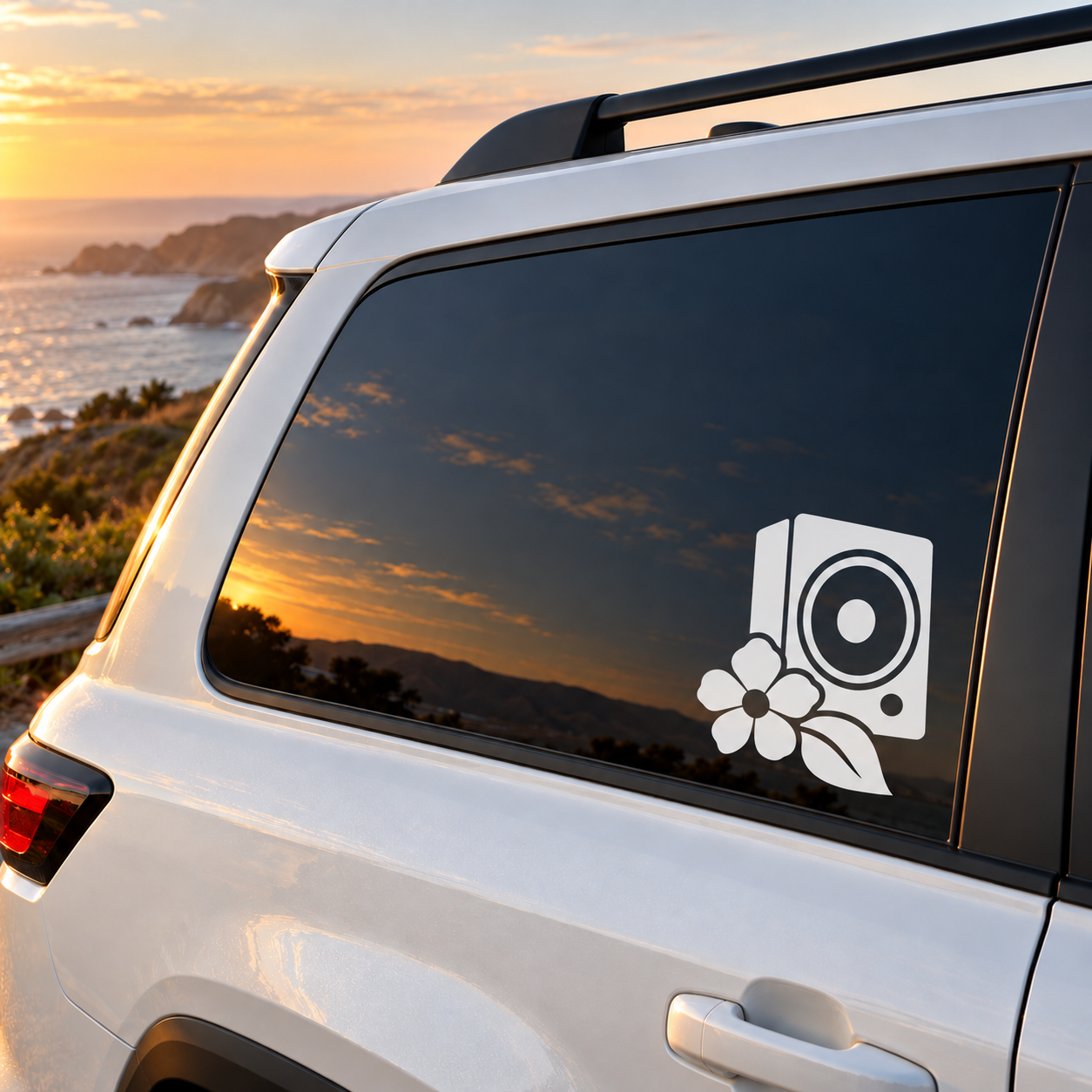 White speaker and bloom flower vinyl decal on a car side window
