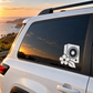 White speaker and bloom flower vinyl decal on a car side window