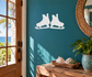 Hockey skate pair vinyl decal, white skate silhouettes on teal background