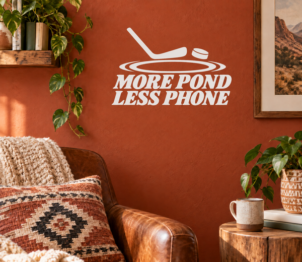 White hockey vinyl wall decal: 'MORE POND LESS PHONE' with puck icon