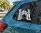 Haunted cinema door vinyl decal with ghost and archway doorway icon on car window