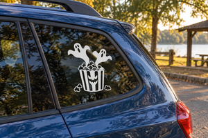Ghost and popcorn vinyl decal on car window, white spooky silhouettes