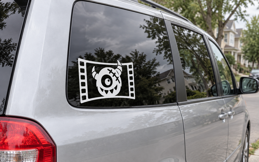 Black filmstrip monster frame vinyl decal on car rear side window