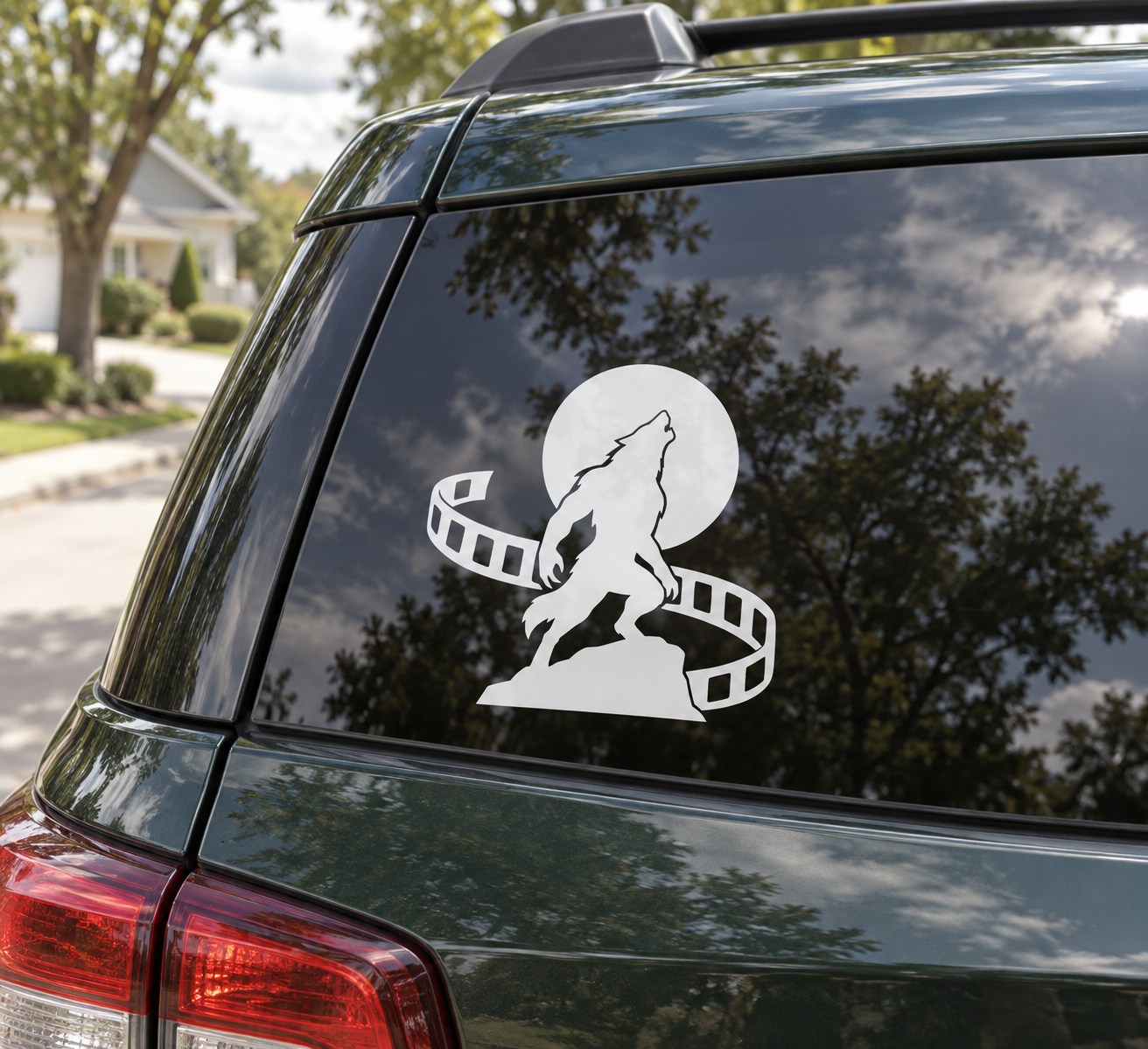 Werewolf moon vinyl decal on car window with film reel