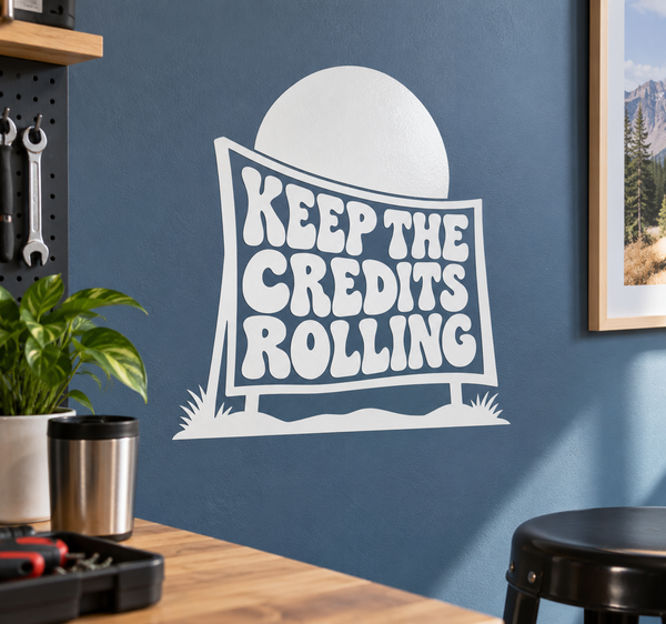 Vinyl decal with white moon and outlined sign reading “KEEP THE CREDITS ROLLING”