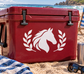 White horse with laurel wreath vinyl decal on red surface