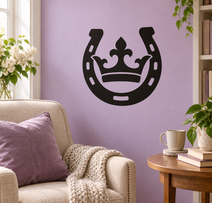 Black horseshoe and crown vinyl decal on wall, centered design with horseshoe outlines
