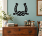 Horseshoe and rope knot vinyl decal with two black horseshoe-shapes and braided center