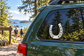 White grooved horseshoe vinyl decal with six nail holes for vehicles