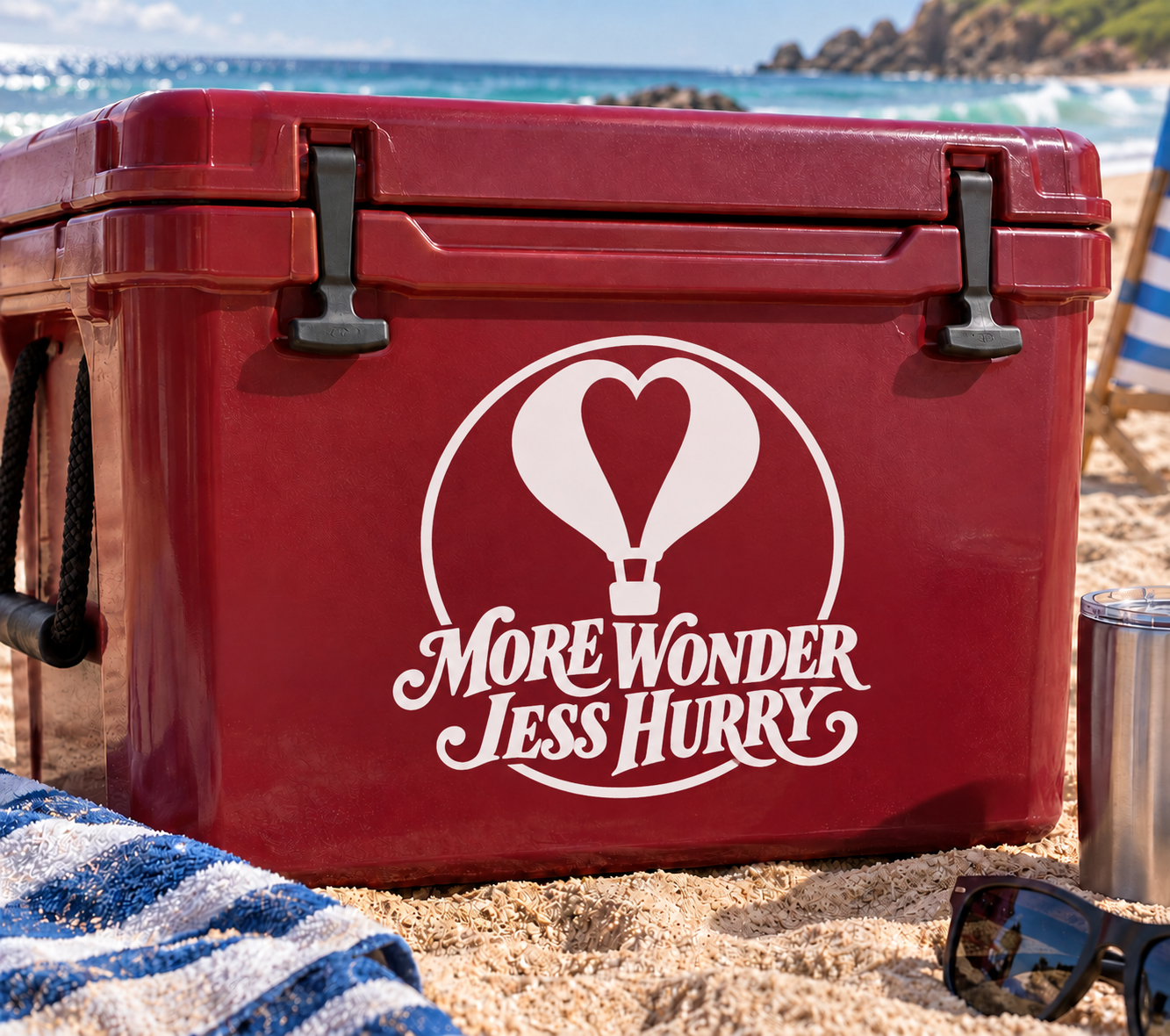 Red vinyl decal with hot air balloon heart and 'More Wonder Less Hurry' text on cooler