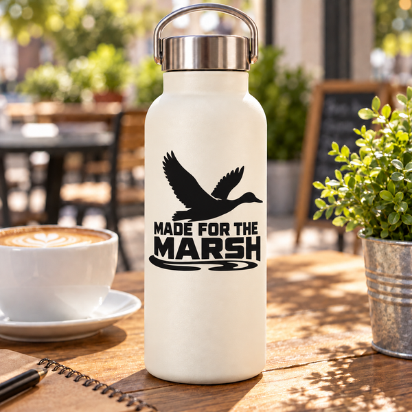 Black vinyl decal with flying bird silhouette and “MADE FOR THE MARSH” lettering on bottle