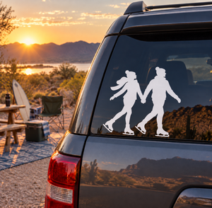 Ice skating vinyl decal of two skaters holding hands, white silhouette on car glass