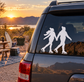 Ice skating vinyl decal of two skaters holding hands, white silhouette on car glass