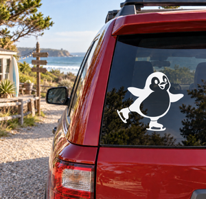 Ice skating penguin vinyl decal on car window, white and black penguin figure
