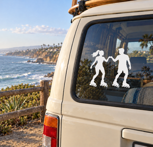 Roller skating vinyl decal of three silhouetted skaters on a car window