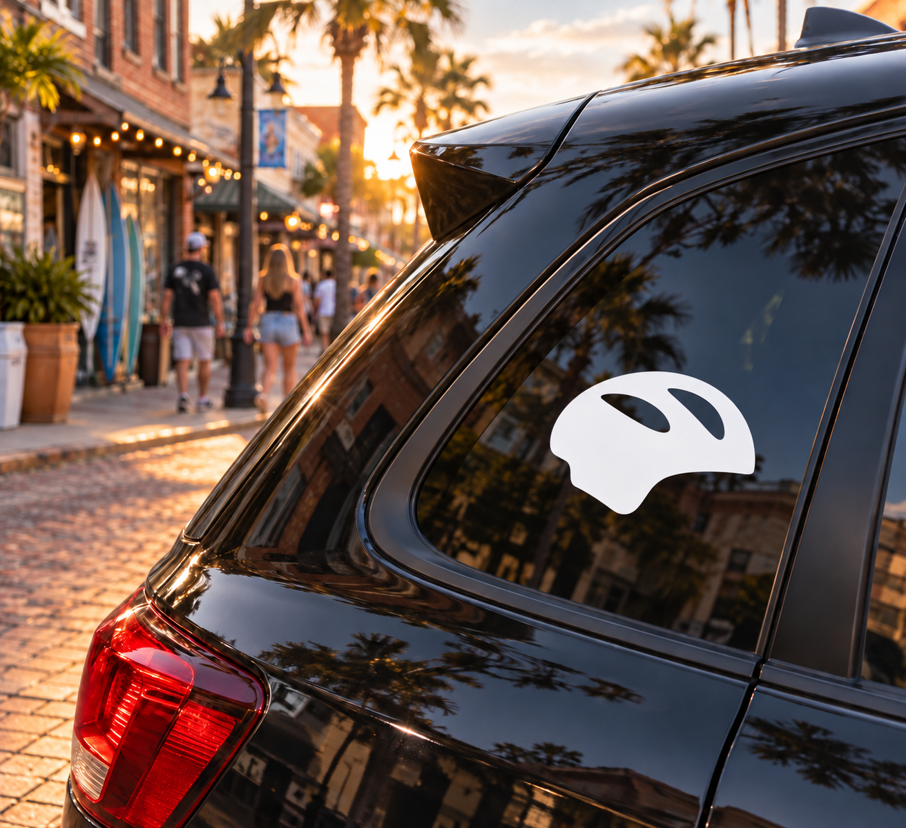Helmet-shaped vinyl decal, white silhouette on dark window