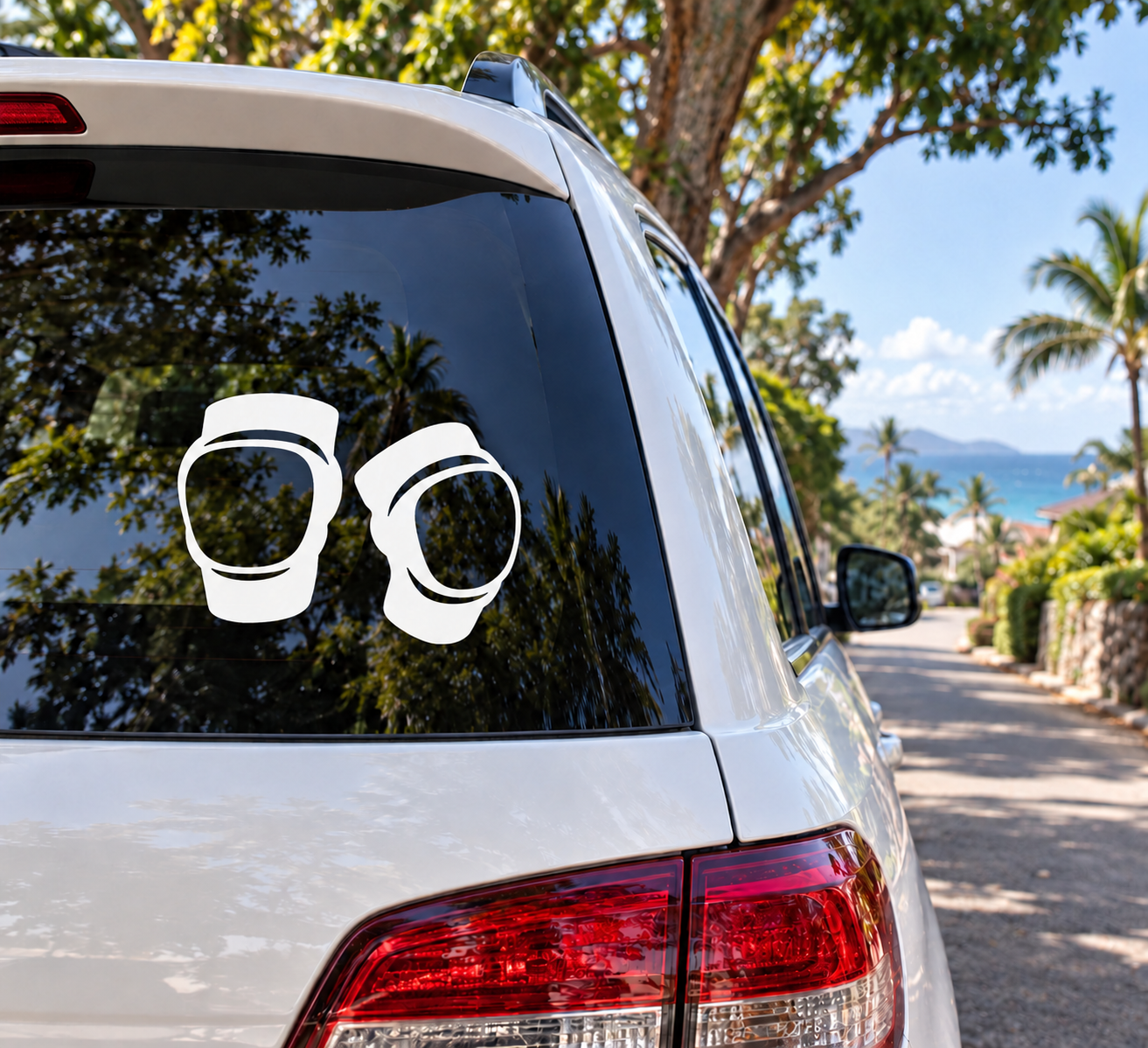 Pair of inline skating knee pad vinyl decals, white outlines on a car window