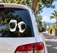 Pair of inline skating knee pad vinyl decals, white outlines on a car window