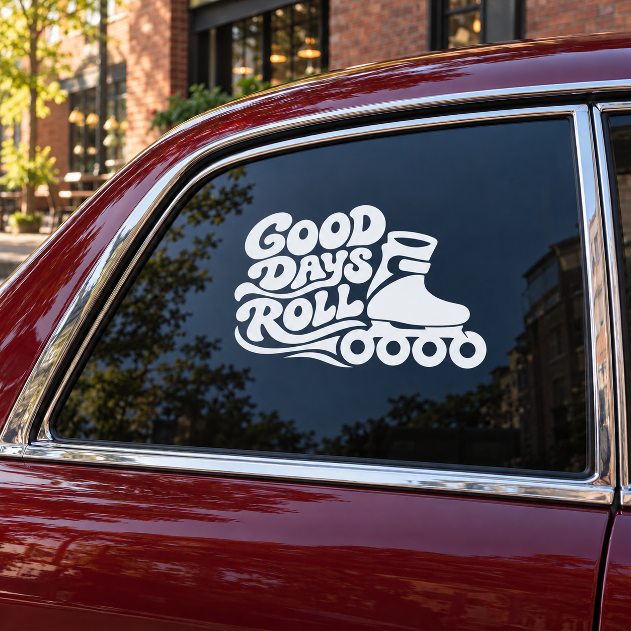 Roll vinyl decal with Good Days Roll roller skate graphic on car window