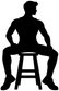 Black jazz dancer vinyl decal silhouette sitting on chair with legs bent