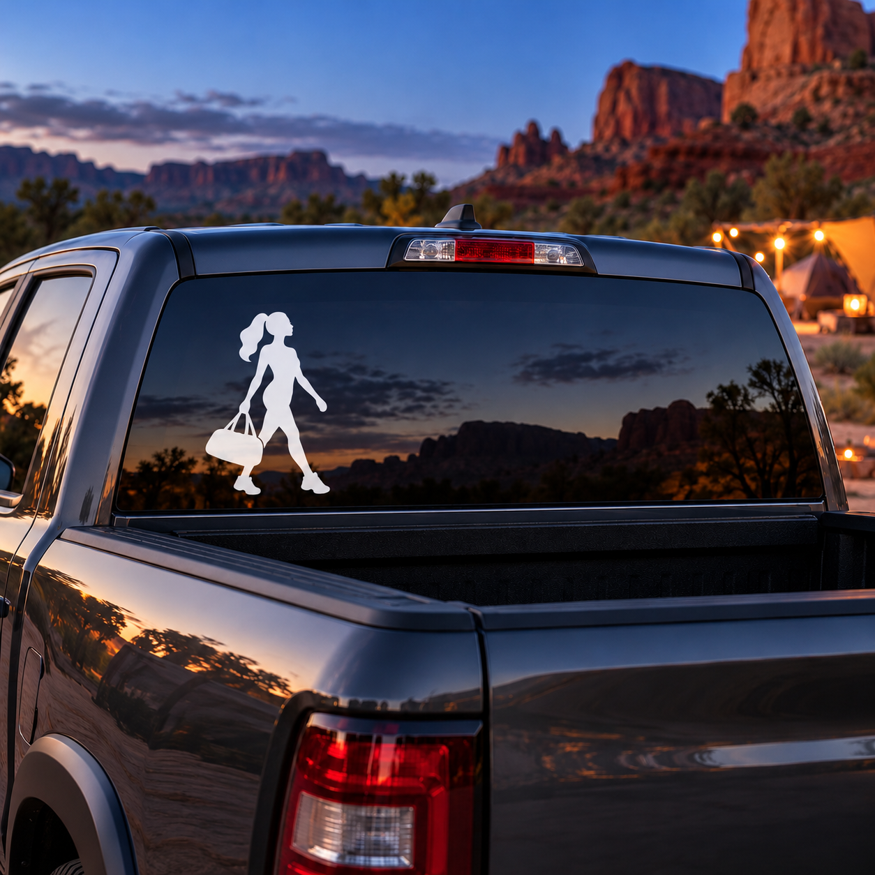 Car rear window vinyl decal of a jazz dancer silhouette holding a bag