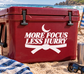 More Focus Less Hurry vinyl decal on red surface with crescent and crossed ribbon