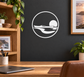 Kayak sunset circle vinyl decal: white outline with kayak silhouette and sun