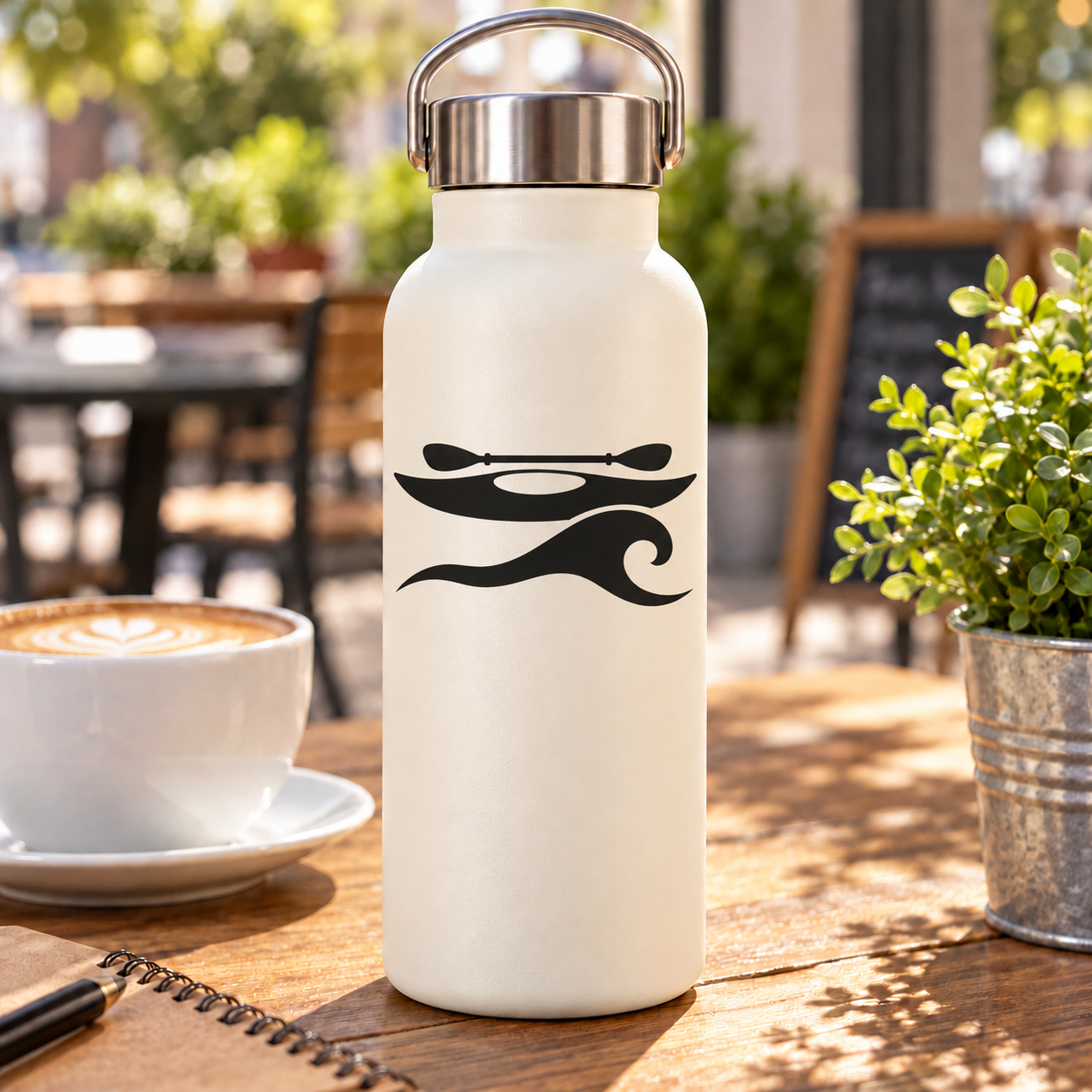 White bottle with black kayak ocean curl vinyl decal