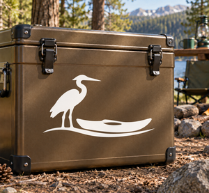 White heron kayak vinyl decal on a brown surface