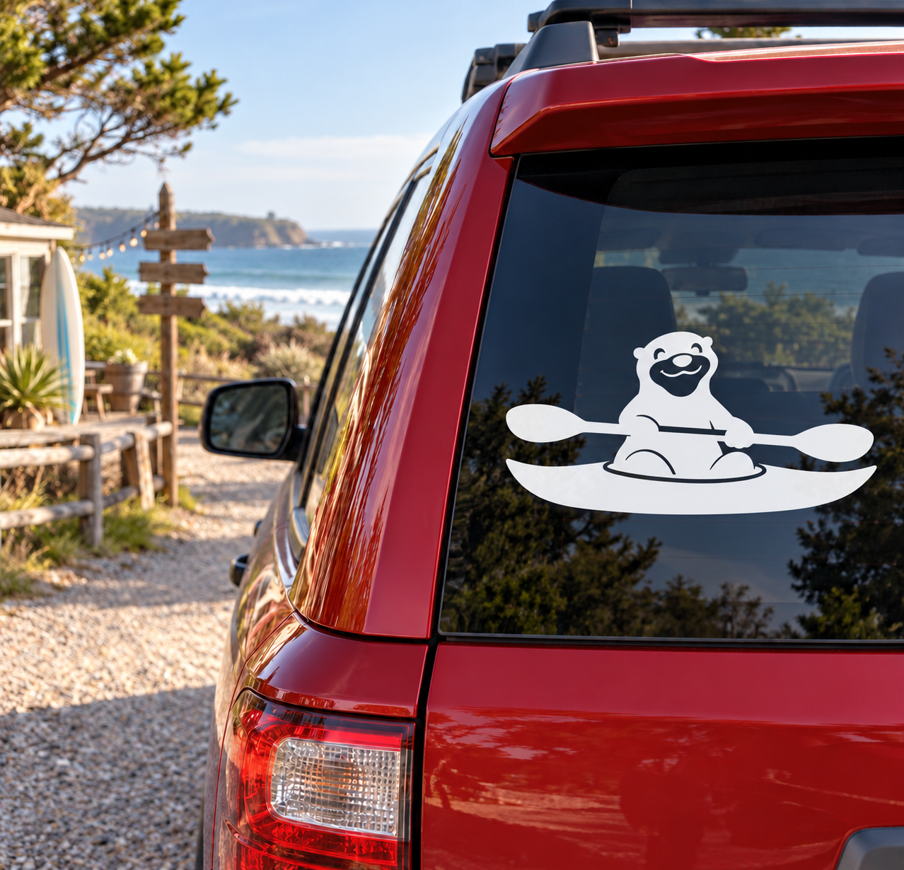 Otter paddling kayak vinyl decal on window, white and black graphic