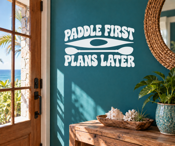 Vinyl wall decal with white “PADDLE FIRST” and “PLANS LATER” plus paddle icon